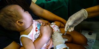 A toddler receives a pentavalent vaccine, which will protect her against diptheria, tetanus, pertussis, influenza type B and hepatitis B, at a health center in Barangay Pinyahan, Quezon City on March 22, 2024. The city government has declared an outbreak of pertussis (whooping cough) after 23 cases and four deaths, mostly infants, from January to March 20. PNA
