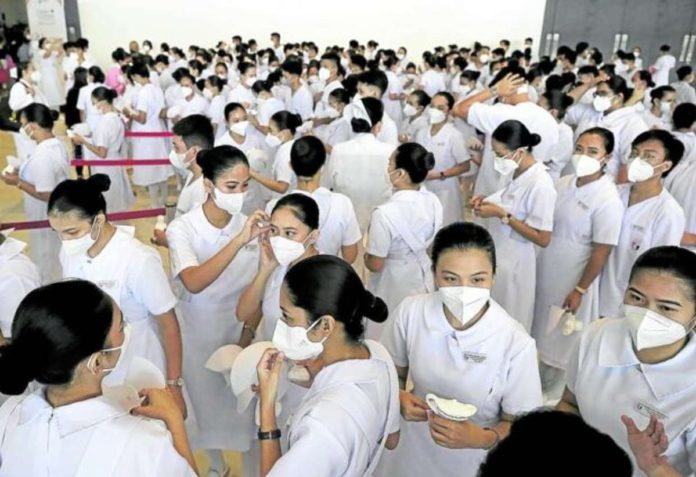 nurses_resized Nursing students wait for the capping and pinning ceremony. INQUIRER FILE PHOTO