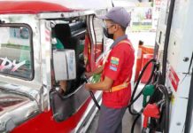 Oil pump prices down today A pump attendant fills up a public utility jeepney at a gasoline station along Samano Road, Camarin, Caloocan. Oil companies will lower prices per liter of gasoline by P0.50, diesel by P0.25, and kerosene by P0.30. effective today, March 12. PNA PHOTO BY BEN BRIONES