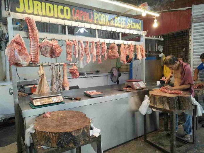 pork_pic_resized Samuel Juridico, with a stall at the Pavia Public Market, sells pork at P400 per kilo. AJ PALCULLO/PN