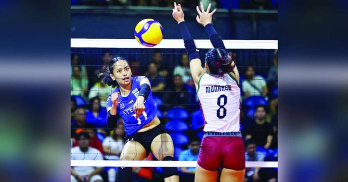 sports Ateneo_superimposed Ateneo de Manila University Blue Eagles’ Geezel Tsunashima scores against the defense of Bacolodnon Joan Marie Monares of University of the Philippines Fighting Maroons. UAAP PHOTO