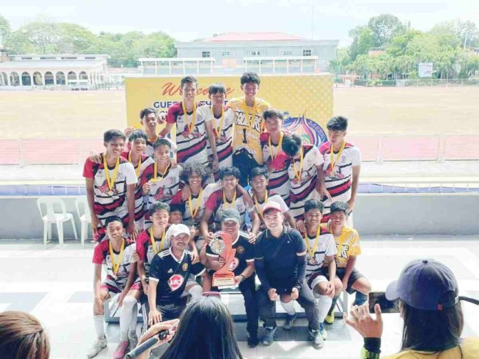 Barotac Nuevo secondary football players with coaches Japheth Buenalatrona and Neigil Ray Belencion. CONTRIBUTED PHOTO