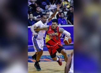 Ilonggo Jericho Cruz of San Miguel Beermen wards off the defense of TNT Tropang Giga’s Jayson Castro as he goes for a basket. PBA PHOTO