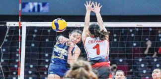 Negrense Arah Panique of National University Lady Bulldogs scores against the defense of University of the East Lady Warriors’ Khy Cepada. UAAP PHOTO