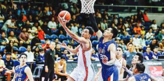 Negrense Jeffrei Chan of NorthPort Batang Pier evades the defense of Meralco Bolts’ Raymond Almazan for a reverse layup. PBA PHOTO