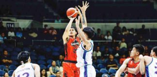 Blackwater Bossing’s Christian David shoots over the defense of Converge FiberXers’ Justin Arana. PBA PHOTO