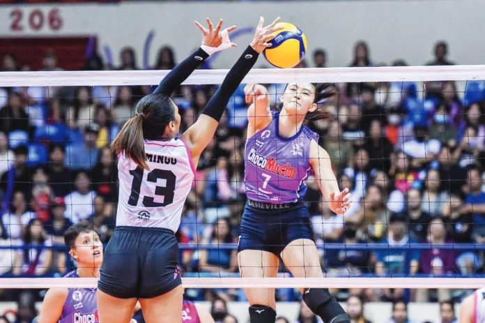 sports_PVL_resized Choco Mucho Flying Titans’ Madeleine Madayag smashes the ball towards the defense of Akari Power Chargers’ Celine Domingo. PVL PHOTO