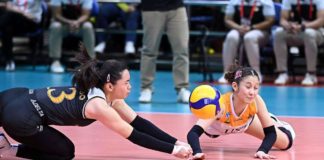 University of Santo Tomas Golden Tigresses’ Jonna Perdido bumps into Bernadett Pepito as the try to save the ball. UAAP PHOTO