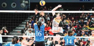 University of Santo Tomas Golden Tigresses’ Bianca Plaza looks to smash the ball towards the defense of Ateneo de Manila University Blue Eagles’ Lyann de Guzman. UAAP PHOTO
