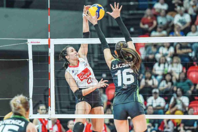 sports_cignal_resized Guimarasnon Jovelyn Gonzaga of Cignal HD Spikers scores against the defense of NxLed Chameleons’ Ivy Lacsina. PVL PHOTO