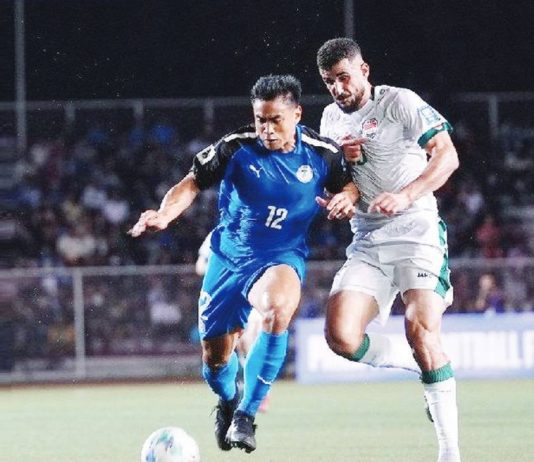 Philippine Azkals’ Armani Aguinaldo kicks the ball away from an Iraqi defender. PNMFT PHOTO