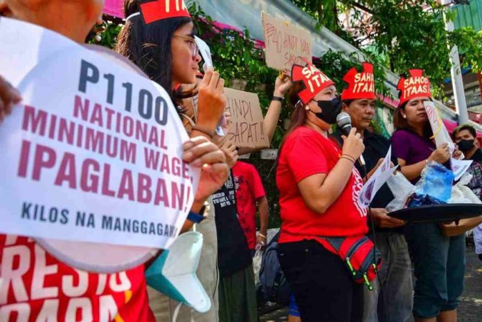 Workers groups picket outside a market in Quezon City on July 3, 2023, calling for wages to be further increased to family living wage levels. MARK DEMAYO, ABS-CBN NEWS/FILE PHOTO