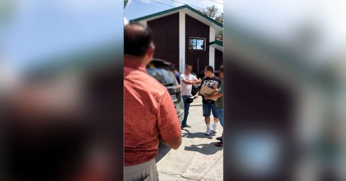 BIR arrest_superimposed The Bureau of Internal Revenue reminds taxpayers to avoid dealing with unscrupulous persons who offer to "fix" their tax obligations. Photo shows authorities arresting a member of the "fixer" syndicate on April 12, 2024. BIR COMMISSIONER ROMEO LUMAGUI/FACEBOOK PHOTO