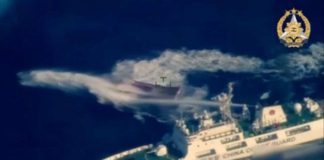 This frame grab from aerial video footage taken and released on March 23, 2024, by the Armed Forces of the Philippines, shows a vessel described by the Philippine armed forces as a China Coast Guard ship (bottom R) deploying water cannon against the Philippine military-chartered civilian boat Unaizah May 4 during its supply mission near the Second Thomas Shoal in disputed waters of the South China Sea. AFP FILE PHOTO