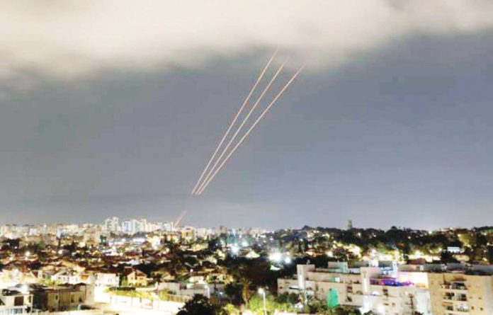 An Israeli anti-missile system operates after Iran launched drones and missiles towards Israel, as seen from Ashkelon on April 13. REUTERS