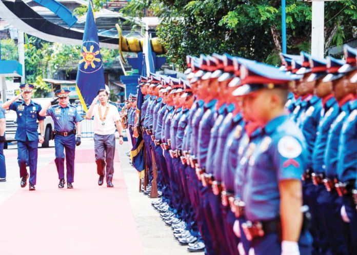 President Ferdinand “Bongbong” Marcos Jr. leads the graduation ceremony of the first batch of Moro combatants who successfully completed the Bangsamoro Police Basic Recruit Course (BPBRC) held at Camp Brigadier General Salipada K. Pendatun in Parang, Maguindanao del Norte yesterday. PCO