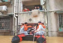 Rescuers evacuate stranded residents on Saturday in the flood-hit city of Shaoguan, Guangdong province of China. Xinhua
