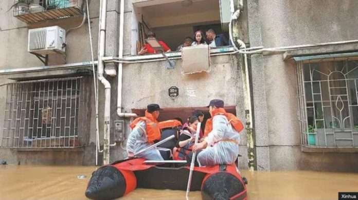 china_resized Rescuers evacuate stranded residents on Saturday in the flood-hit city of Shaoguan, Guangdong province of China. Xinhua