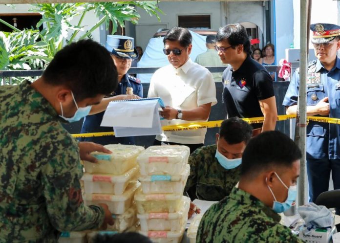 President Ferdinand Marcos Jr. along with Interior Secretary Benjamin Abalos Jr. and Philippine National Police chief General Rommel Francisco Marbil check on the inspection of crystal meth seized in a Batangas town. The operation which led to the seizure of shabu weighing around two tons and amounting to P13.2 billion, is the biggest-ever drug bust in the country. PCO