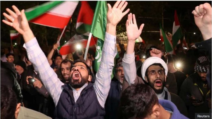 israel_resized Iranian demonstrators in Tehran react after the Iranian attack on Israel. REUTERS