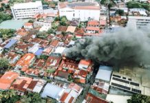 This drone shot captures the scale of the fire that hit a thickly-populated neighborhood in Barangay San Nicolas, La Paz, Iloilo City on Feb. 18, 2024. MORE POWER PHOTO