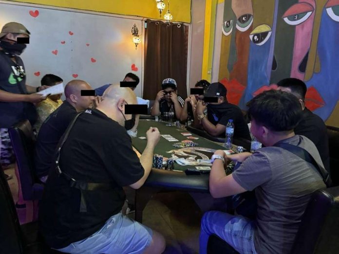 mai_poker_raid_resized_resized Raided by Iloilo City policemen, stunned card players try to conceal their poker face. ILOILO CITY POLICE PHOTO