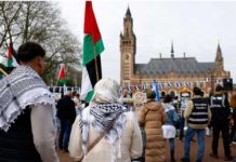 Germany faces genocide case over Israel weapon sales Demonstrators with Palestinian and Nicaraguan flags gather outside the International Court of Justice in The Hague on April 8. Reuters
