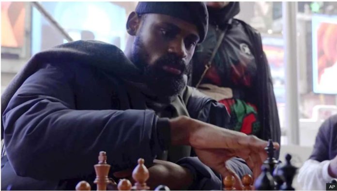 nigeria_resized In this screen grab taken from video, Tunde Onakoya, a Nigerian chess champion and child education advocate, play a chess game in Times Square, New York. AP