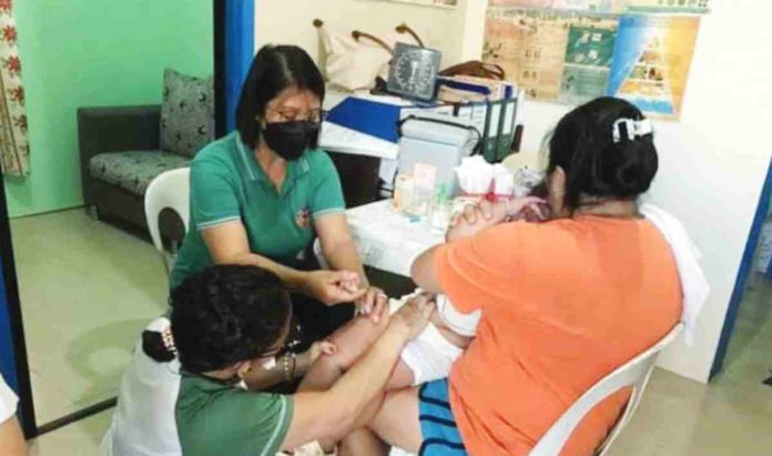 The Department of Health announced on Monday, April 8, that vaccines against pertussis may face a shortage by May. Photo shows an infant receiving free vaccination at a barangay health center. CONTRIBUTED PHOTO