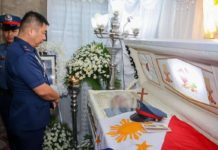 Brigadier General Jack Wanky, the Western Visayas police director, pays his respects to slain intelligence officer Police Corporal Reo Manero in Lambunao, Iloilo. “The loss and bravery of Police Corporal Manero are deeply felt by the entire Police Regional Office 6 community. His commitment and passion for duty will forever be honored and remembered,” says Wanky. PRO-6 PHOTO
