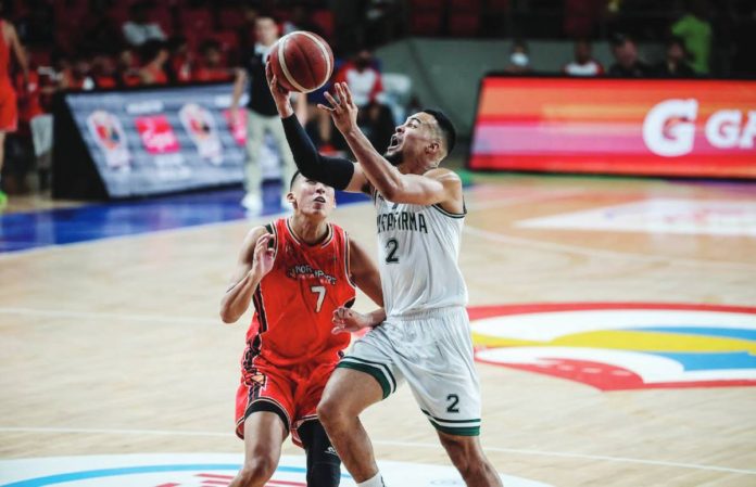 sports PBA Terrafirma Dyip’s Stephen Holt goes for a layup as NorthPort Batang Pier’s Zavier Lucero looks on. PBA PHOTO