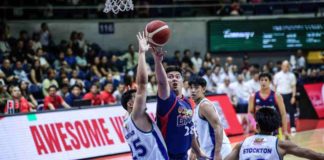 Rain or Shine Elasto Painters’ Beau Belga goes for a reverse shot against the defense of Aklanon Keith Zaldivar of Converge FiberXers. PBA PHOTO