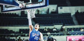 Meralco Bolts’ Raymond Almazan scores on a one-handed dunk. PBA PHOTO