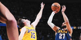 Denver Nuggets’ Jamal Murray converts a game-winning basket against the defense of Los Angeles Lakers’ Austin Reaves. AP