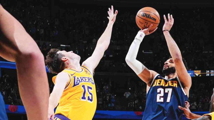 sports_NBA_resized Denver Nuggets’ Jamal Murray converts a game-winning basket against the defense of Los Angeles Lakers’ Austin Reaves. AP