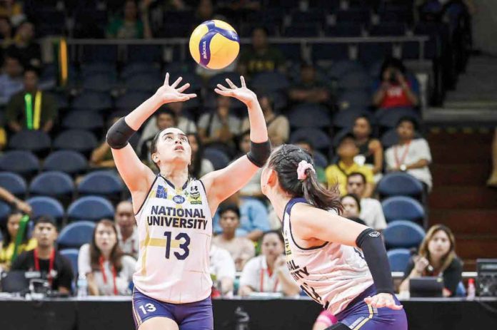 Guimarasnon Camille Lamina tosses the ball to a National University Lady Bulldogs teammate. UAAP PHOTO