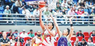 San Miguel Beermen's Celedonio Trollano evades the defense of Converge FiberXers' Alec Stockton for an inside hit. PBA PHOTO