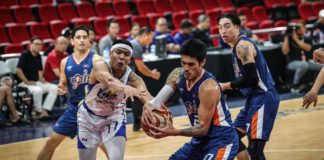 Magnolia Chicken Timplados Hotshots' Jerrick Balanza and Meralco Bolts' Raymond Almazan battle for the rebound. PBA PHOTO