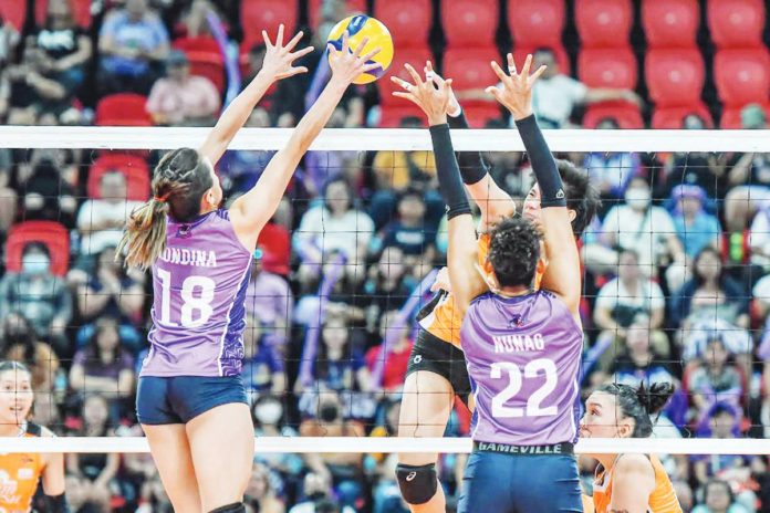 Choco Mucho Flying Titans’ Cherry Rondina attempts to block the shot of Negrense Alyssa Bertolano of Farm Fresh Foxies. PVL PHOTO