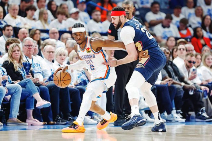 Oklahoma City Thunder’s Shai Gilgeous-Alexander tries to ward off the defense of New Orleans Pelicans’ Larry Nance Jr. PHOTO COURTESY OF SPORTSKEEDA