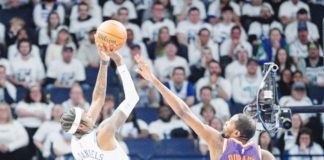 Minnesota Timberwolves’ Jaden McDaniels (3) shoots against Phoenix Suns’ Kevin Durant (35). BRAD REMPEL-USA TODAY SPORTS