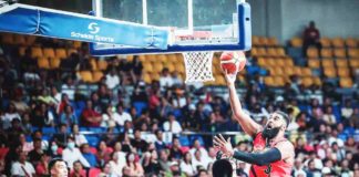 San Miguel Beermen’s Moala Tautuaa attacks the defense of Terrafirma Dyip’s Kemark Carino for a layup. PBA PHOTO