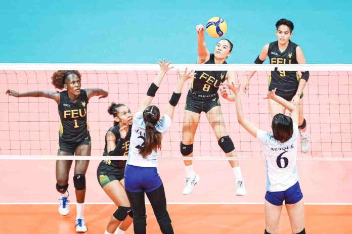 sports_UAAP_resized Far Eastern University Lady Tamaraws’ Mitzi Panangin drops the ball against the defense of Adamson University Lady Falcons. UAAP PHOTO