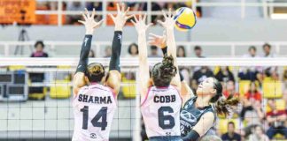 Chery Tiggo Crossovers’ Eya Laure attempts to score against the defense of Akari Power Chargers’ Michelle Cobb. PVL PHOTO
