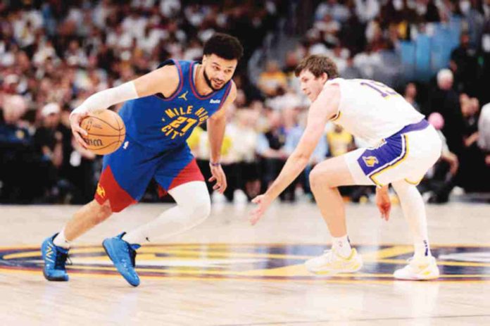 Denver Nuggets’ Jamal Murray (27) drives to the basket against Los Angeles Lakers’ Austin Reaves (15). PHOTO BY ANDREW WEVERS-USA TODAY SPORTS