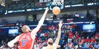 Los Angeles Lakers’ D’Angelo Russell shoots against New Orleans Pelicans’ Jonas Valanciunas. PHOTO COURTESY OF GERALD HERBERT/ASSOCIATED PRESS