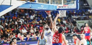 Magnolia Chicken Timplados Hotshots’ Joseph Eriobu scores against the defense of Phoenix Fuel Masters' Kenneth Tuffin. PBA PHOTO