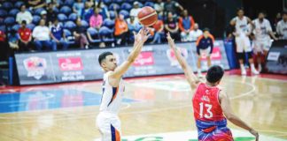 Ilonggo Anjo Caram of Meralco Bolts pulls up for a three-pointer against the defense of Phoenix Fuel Masters' RJ Jazul. PBA PHOTO