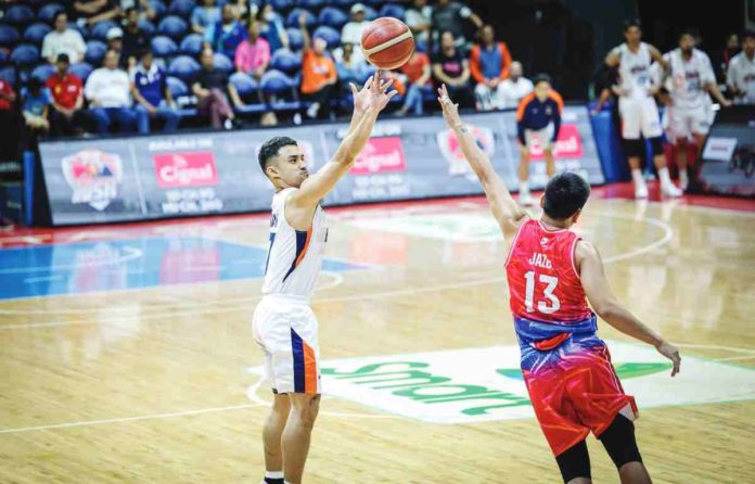 sports_meralco_resized Ilonggo Anjo Caram of Meralco Bolts pulls up for a three-pointer against the defense of Phoenix Fuel Masters' RJ Jazul. PBA PHOTO