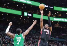 Miami Heat’s Bam Adebayo (13) shoots against the defense of Boston Celtics’ Jaylen Brown (7). PHOTO COURTESY OF DAVID BUTLER II-USA TODAY SPORTS